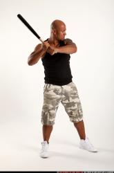 Man Adult Athletic Black Standing poses Casual Fighting with bat